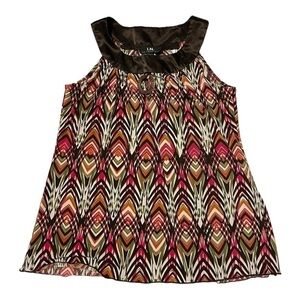BOHO style shell with detailed neckline.